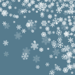 Christmas snow background with scattered snowflakes falling in winter