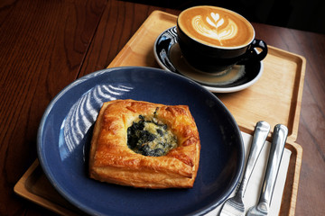 Spinach pie with hot coffee