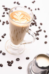 Hot Cappuccino  coffee  in clear glass on a white background in the studio.	