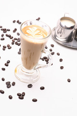 Hot Cappuccino  coffee  in clear glass on a white background in the studio.	