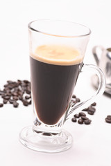hot coffee  in clear glass on a white background in the studio.	
