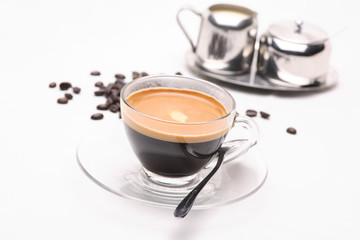 hot coffee  in clear glass on a white background in the studio.	