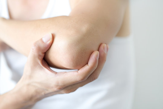 Sport men have elbow pain .Health concepts and treatments