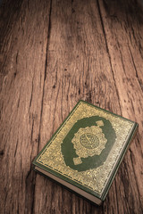 Koran - holy book of Muslims ( public item of all muslims ) on the table , still life