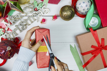 Unknown woman preparing Christmas present