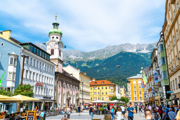 INNSBRUCK, AUSTRIA - AUGUST 29, 2019: Innsbruck town center with lots of people and street cafes in Innsbruck, Tyrol, Austria - obrazy, fototapety, plakaty