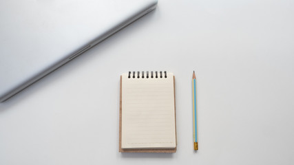 Office desk table Top view  notebook with pencil