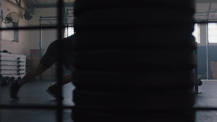 fitness athletes training intense workout strong men exercise together using weights enjoying strength challenge in gym friends bodybuilding practice healthy lifestyle slow motion