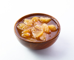 jam in wooden dish on wooden table