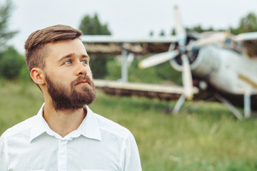 a man on the background of an old plane