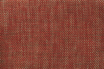Dark orange textile background with checkered pattern, closeup. Structure of the fabric macro.