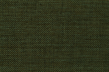 Dark green background of dense woven bagging fabric, closeup. Structure of the textile macro.