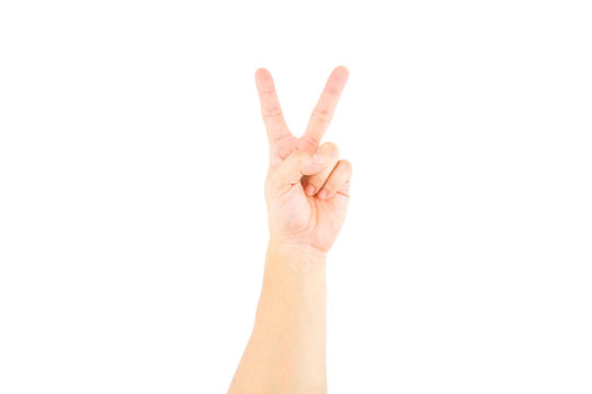 Asian male hand showing v sign on white background.