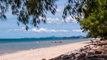 Beautiful Cha-am beach with blue sky and pine trees. © Pongvit