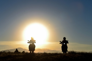 Fototapeta na wymiar motorcyclists traveling at sunrise time