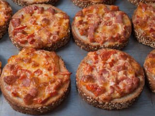 Quick Easy Snack. Sesame Bread Baked With Salami And Cheese On Oven Tray. Mini Pizza