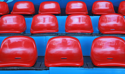 Fototapeta premium Red seats on the row at the stand.