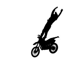 SILHOUETTE Pro motocross rider riding fmx motorbike, jumping performing extreme stunt. Professional biker jumps