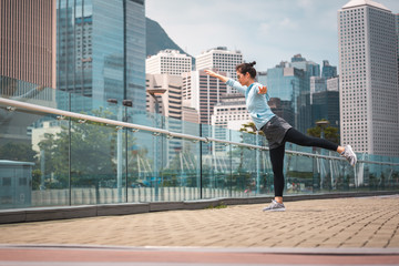 Fototapeta na wymiar Woman doing workout in Hong Kong