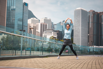 Urban woman doing workout in the city