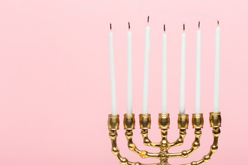 Bronze Hanukkah menorah with burning candles