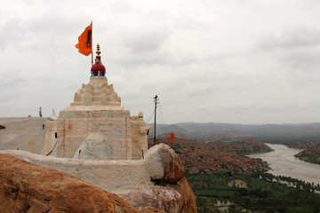Translation: the pagoda of Hanuman Temple at Anjana mountain of Hampi (crossing the river in...