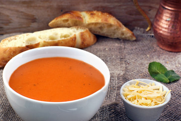 Lentil soup puree with cheese in a white plate
