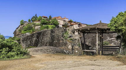 Wooden gazebo under the walls of the monastery