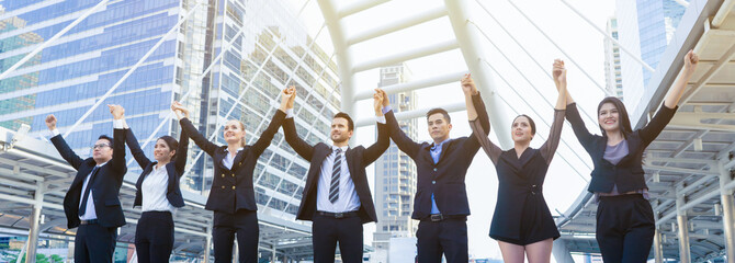 business people group partnership joining hands up and representing friendship and teamwork,Diversity businessman and businesswomen team shaking hands together in the air for success of business plans