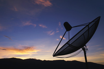 Satellite Dish with Mountain Background at Twilight