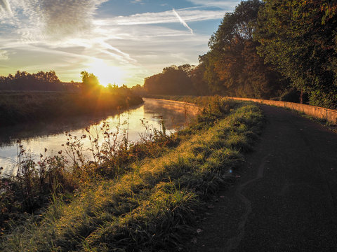 Gorgeous sunrise over the river Dyle near Mechelen, Belgium, during an early misty morning in September