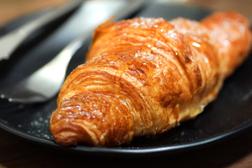 croissants with honey on plate close yummy