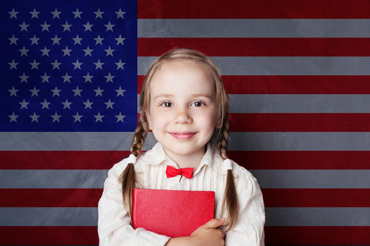 English concept with little girl student with book against the UK flag background. Learn language