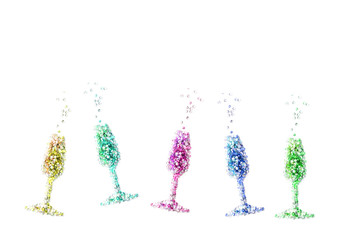 Champagne glasses with colorful confetti tinsel on white background. Celebrate party concept. Flat lay, top view 