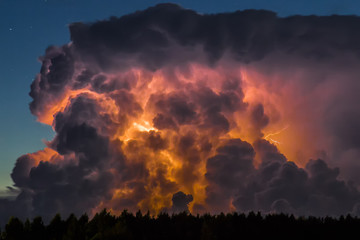 Fototapeta na wymiar Thunderstorm cloud early in the morning, in summer before sunrise