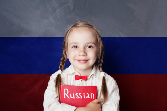 Russian concept. Child girl student with red book on the Russian flag background