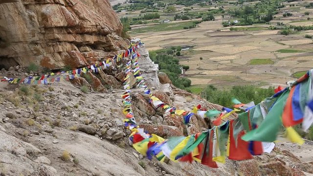 Plenty of colorful Buddhist prayer flags on the Stupa near Takthok gompa, Buddhist monastery in Ladakh, Jammu & Kashmir, India