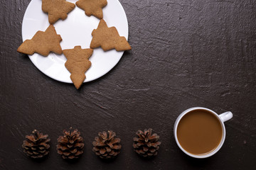 Coffee with cookies in shape of Christmas tree