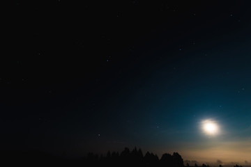 Night moon sky, full moon, Moon over the lake. Night landscape. Reflection of the rays from the moon in the water.