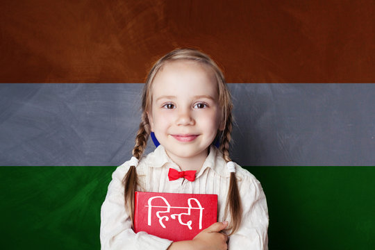 Learn hindi language. Smart child student on India flag background