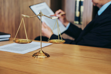 Judge gavel with Justice lawyers, Businessman in suit or lawyer working on a documents. Legal law, advice and justice concept