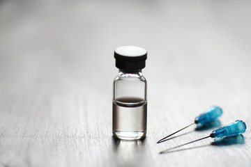 Ampoule and needles from a medical syringe