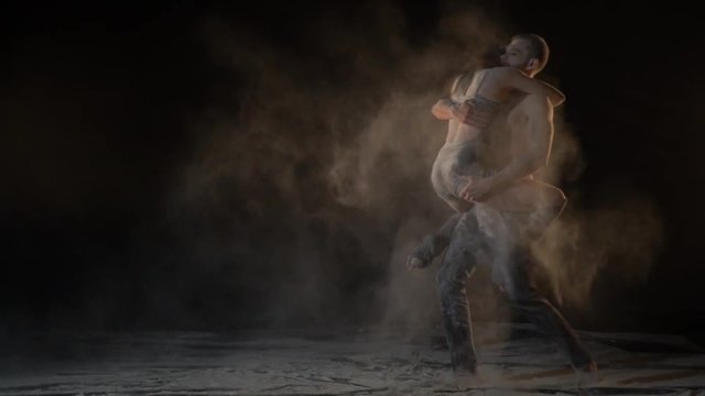 A woman runs to the man and jumps in his arms