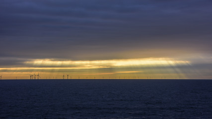 Fototapeta na wymiar Sky sea and Wind Mills from Amsterdam