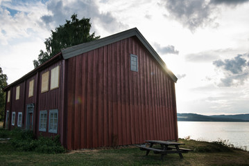 Fototapeta na wymiar scenic view of red building near lake, Hamar, Hedmark, Norway