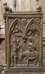 Fototapeta na wymiar Stalle médiévale dans la basilique Saint-Andoche de Saulieu, Côte-d'Or, France