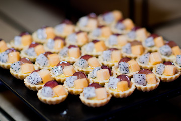 buffet food, catering food party at restaurant, mini canapes, snacks and appetizers