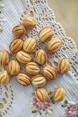 Traditional russian festive cookies in nut shape with caramelized milk inside