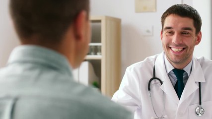 medicine, healthcare and people concept - smiling doctor and male patient having health problem meeting at hospital - Powered by Adobe