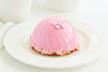 A cake in the form of a heart. Valentine's Day.